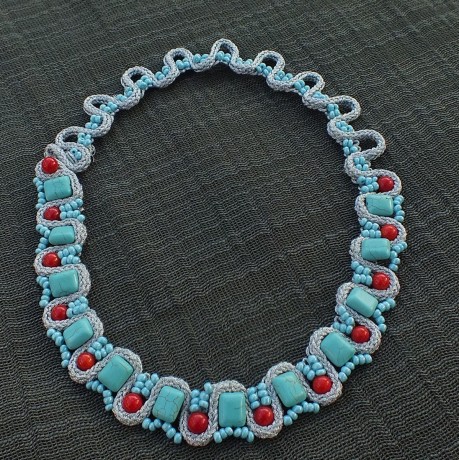 Soutache necklace with silver metallic braid, red coral beads, blue tourquose beads and blue glass seed beads.